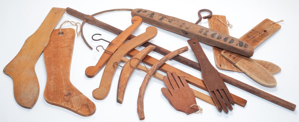 GROUP OF WOODEN CLOTHES HANGERS AND FORMS. (1 of 5)