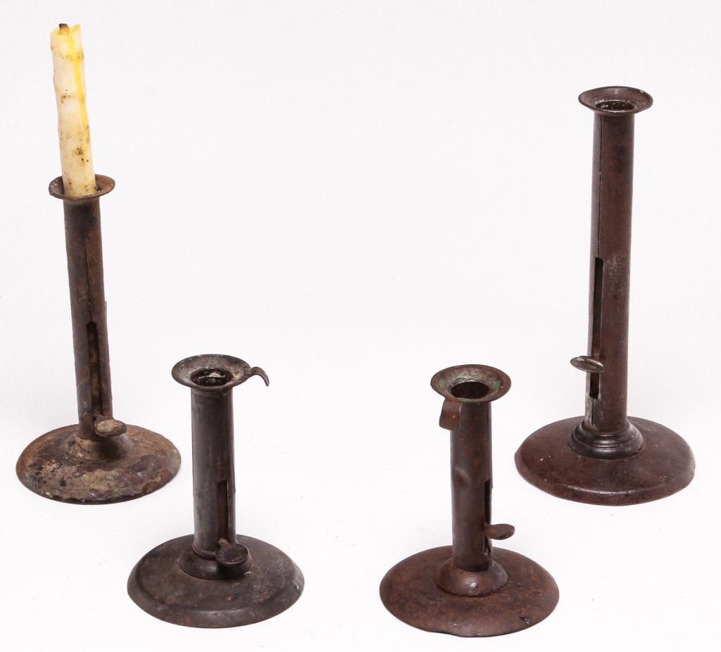 FOUR HOG SCRAPER CANDLESTICKS. (1 of 2)
