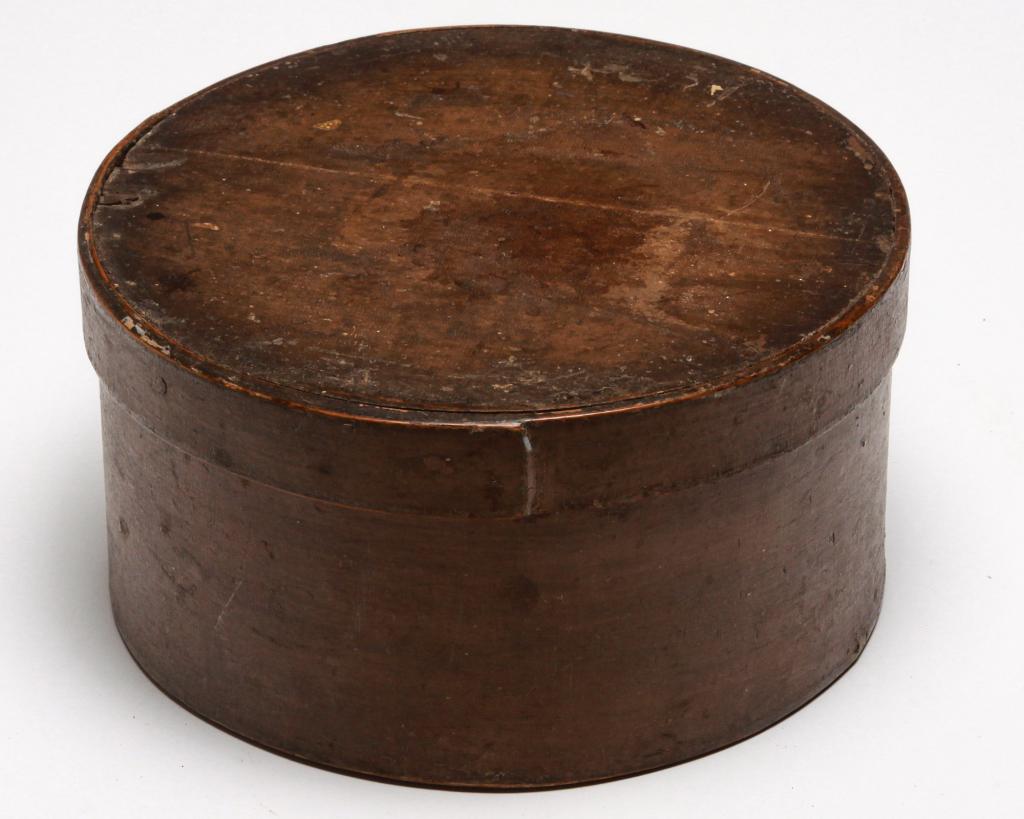 AMERICAN BENTWOOD PANTRY BOX.: Second half 19th century. Lapped seams with iron tacks. Old putty/tan paint over darker brown. Wear, age split and flakes in lid. 4.25"h. 8"d.