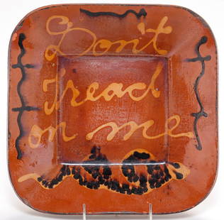 TURTLE CREEK, OHIO REDWARE BOWL.: Signed and dated "Chris Woods, 2000". Square bowl with slip decoration "Don't Tread on Me". Distressed surface 2.5"h. 11.75" x 11.75".