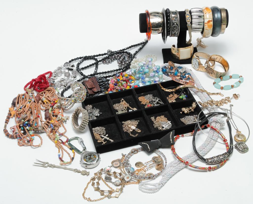 TOTE OF VINTAGE AND NEWER TREASURES.: Mid-late 20th century. Tote filled with vintage to modern costume and fashion jewelry - beads, bracelets, necklaces, earrings, pins, watches and more.