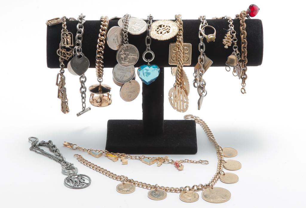 VINTAGE COSTUME CHARM BRACELETS AND ONE NECKLACE. (1 of 2)