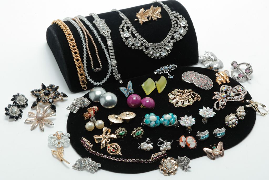 VINTAGE JEWELRY TO TAKE YOU FROM DAY TO NIGHT.: Mid-late 20th century. Simple to sparkling and everything in between. This group of costume jewelry has something for every time of day including three necklaces, one sweater clip, seventeen pairs of 