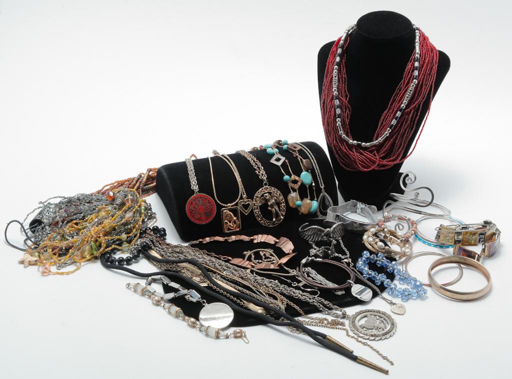ASSORTMENT OF NECKLACES AND BRACELETS.: Mid-20th â€“ early 21st century. Group of vintage and newer costume necklaces and bracelets including marked pieces by Monet, 1928, Goldette and Walt Disney.