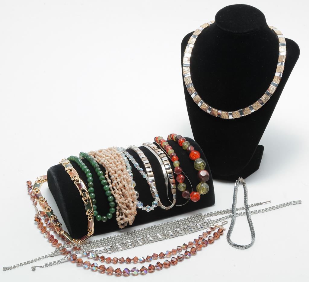 TWELVE VINTAGE CHOKER STYLE NECKLACES.: Mid-late 20th century. Attractive assortment of twelve chokers including rhinestones, crystal, beads, and silver and gold tone. Marked pieces by Monet and Napier.