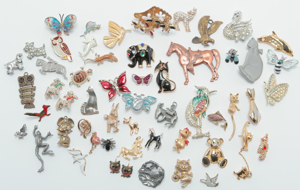 CAVALCADE OF CREATURES.: Mid-late 20th century. Group of fifty-five pins and pendants of favorite creatures â€“ birds, owls, butterflies, cats, dogs, horses, bears, elephants, frogs, spiders, bees, flamingo, fish and eve