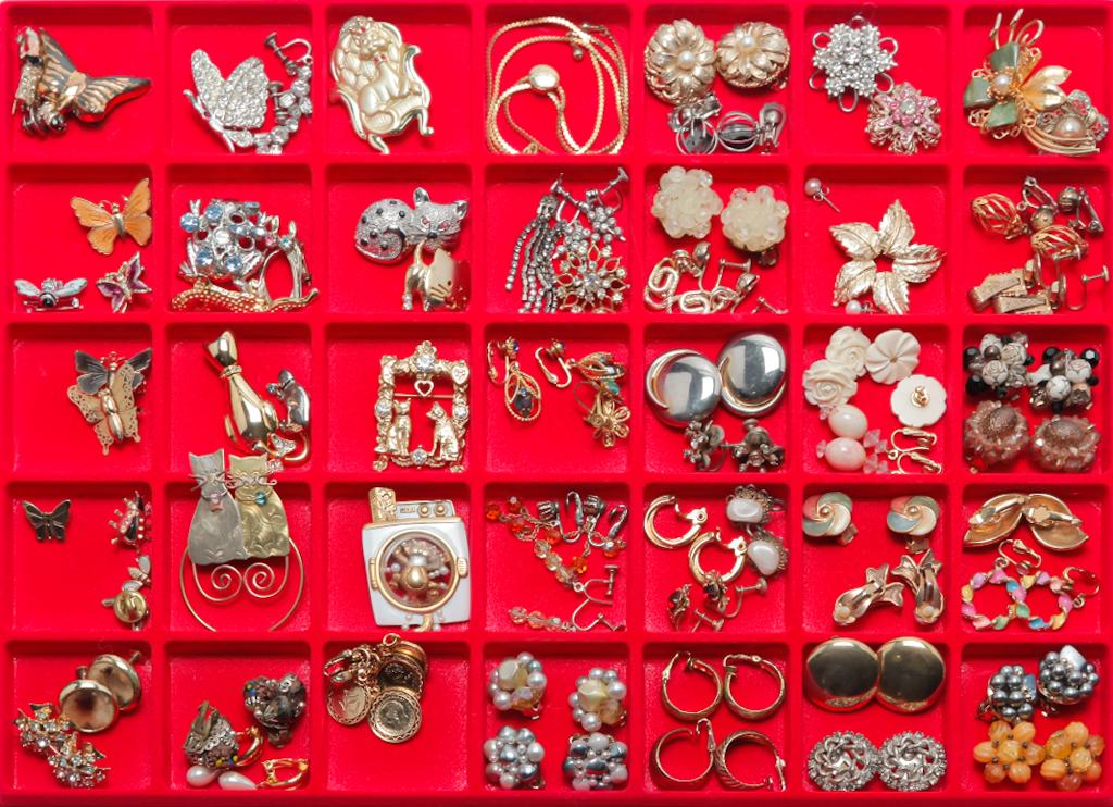 VINTAGE TO NEWER COSTUME PINS AND EARRINGS.: Mid-late 20th century. A little of everything in this group â€“ bug and butterfly pins, cat pins, dangling earrings, hoop earrings, rhinestone earrings and more. A few missing small stones.