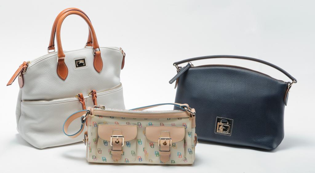 THREE VINTAGE DOONEY & BOURKE HANDBAGS. (1 of 4)