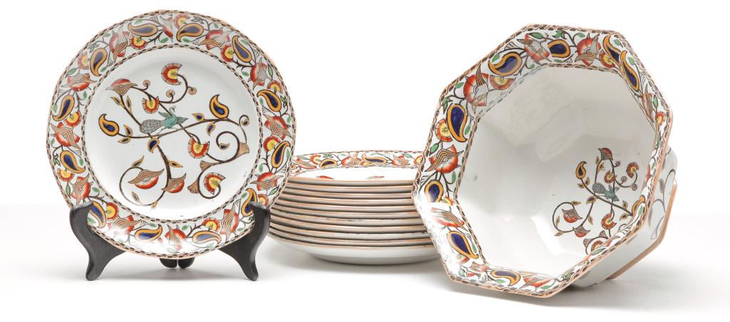 THIRTEEN PIECES OF ADAMS IRONSTONE.: Ca. 1900. Transfer pattern with polychrome decoration "Khanware". Octagonal bowl, 5.25"h. 10"d. and twelve plates, 9"d.