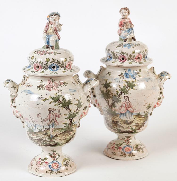 A PAIR OF EUROPEAN FAIENCE URNS. (1 of 2)