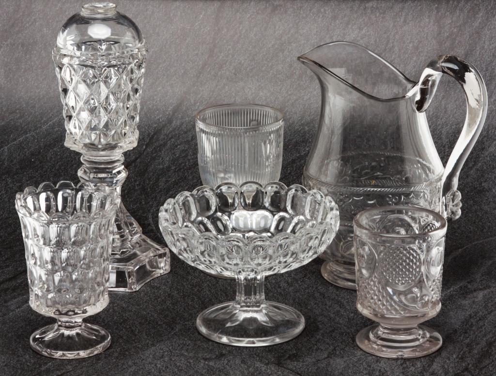 GROUP OF AMERICAN FLINT PATTERN GLASS.: Third quarter nineteenth century.. Clear and in various patterns including bell flower, loop, Sawtooth, thumb print, horn of plenty and etc. Some damage.