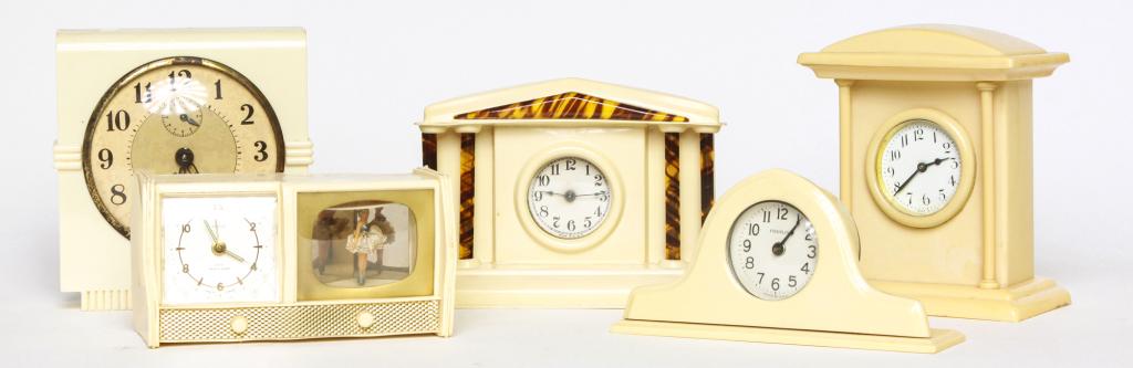 SIXTEEN  AMERICAN CELLULOID COVERED CLOCKS. (1 of 1)