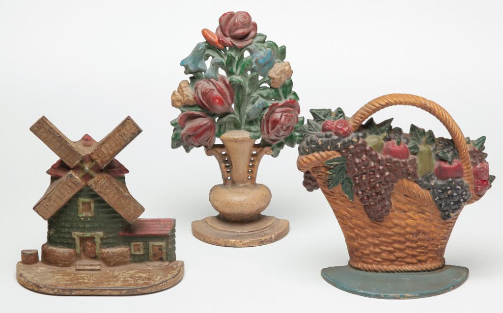 THREE AMERICAN DOOR STOPS. (1 of 4)