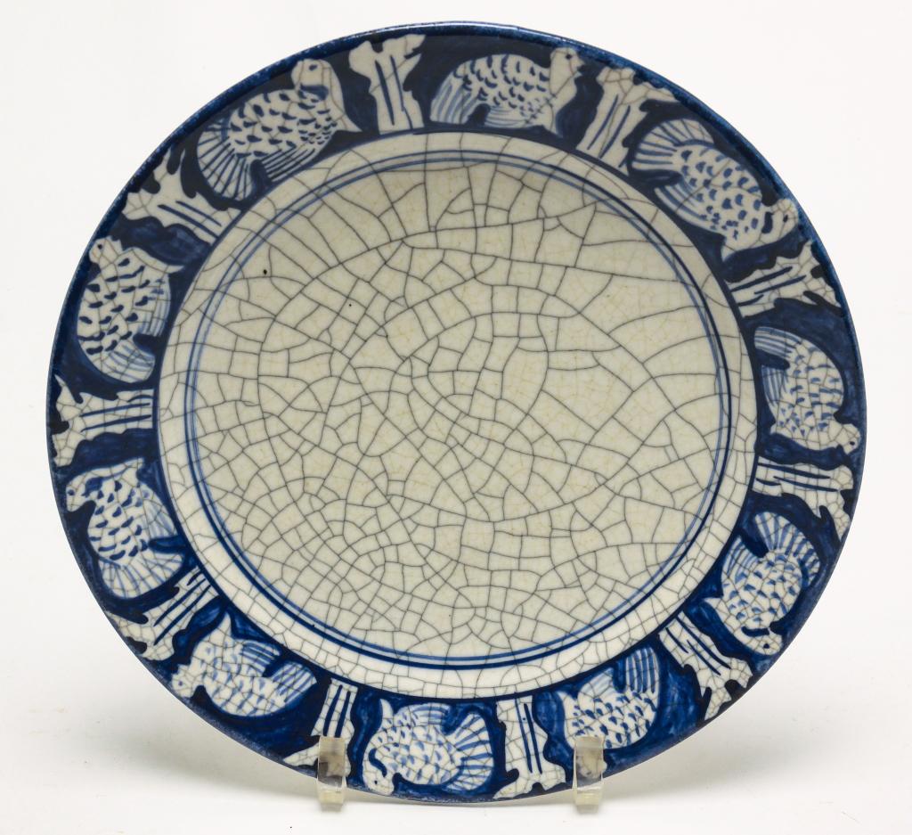 AMERICAN DEADHAM POTTERY TURKEY BORDER PLATE.: First half 20th century. Heavy ironstone pottery with border of ten turkeys separated by trees. Crackle glaze. 10.25"d.