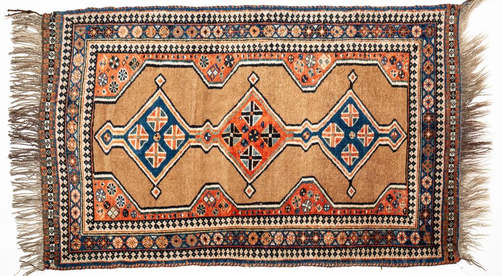 CAUCASIAN RUG.: Second half 20th century. Multiple borders and camel ground. 2'6" x 4'.