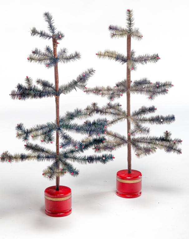 PAIR OF AMERICAN FEATHER TREES.: Second half 20th century. Wire branches and paper wrapped trunks. Original red and gold paint on base. Some wear. 34"w.
