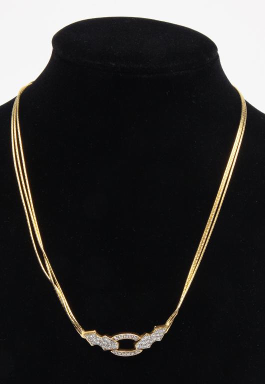 BALESTRA 14K GOLD AND DIAMOND NECKLACE.: Italian, 20th century. Signed and hallmarked Balestra, Italy. 14K yellow gold choker style necklace featuring hinged, diamond set center piece, triple strand delicate gold chain. Overall length approx