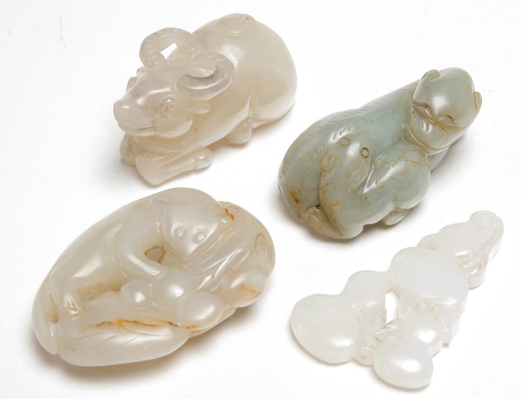 FOUR CHINESE JADE CARVINGS WITH ANIMALS. (1 of 2)