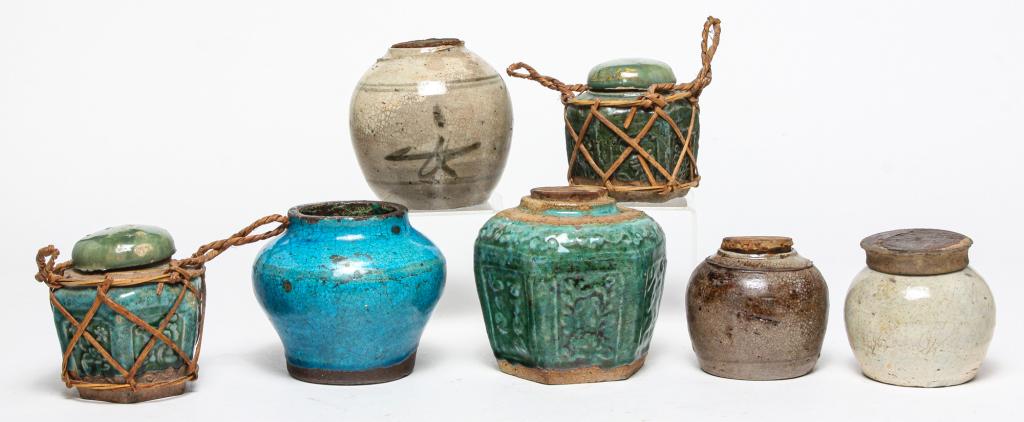 SEVEN ASIAN POTTERY CONTAINERS. (1 of 6)