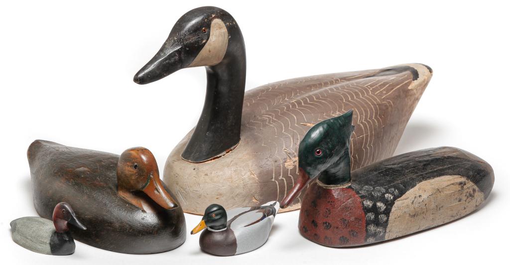 FIVE AMERICAN CARVED AND PAINTED DECOYS.: Twentieth century. "Decoys Unlimited," Erie, PA goose, 12.5"h. Jim McIlhinny, 1978, red head 3"h. Gary Birdem(?), 1985 mallard, 3"h. A merganser, 7.5"h. And a female mallard, 5.75"h.