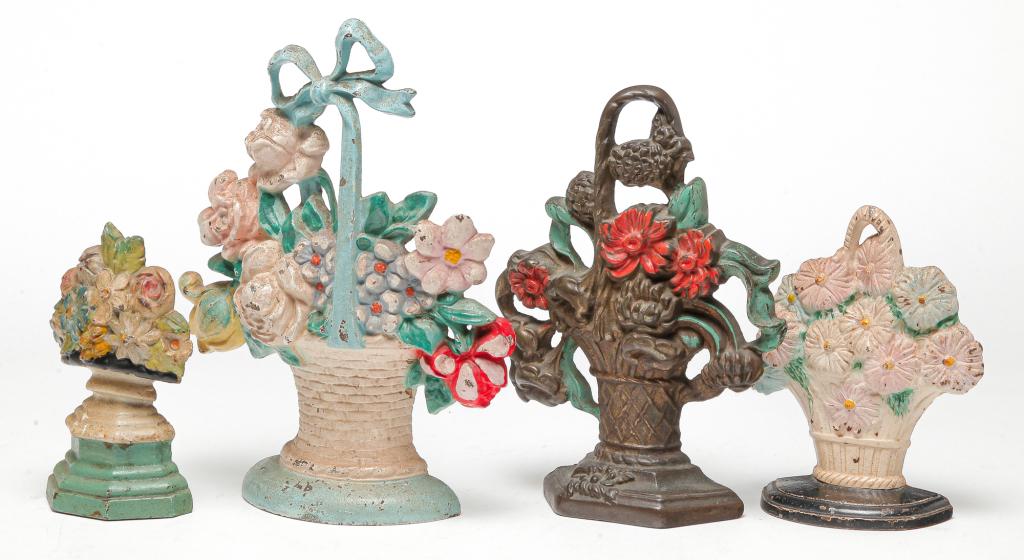 FOUR AMERICAN CAST IRON DOORSTOPS. (1 of 2)