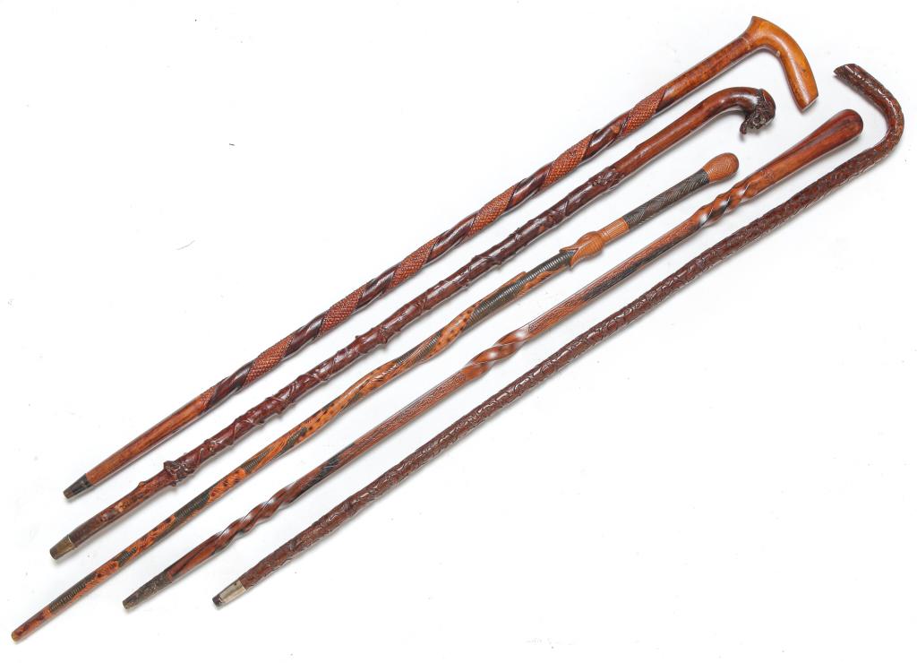 FIVE CARVED CANES. (1 of 8)