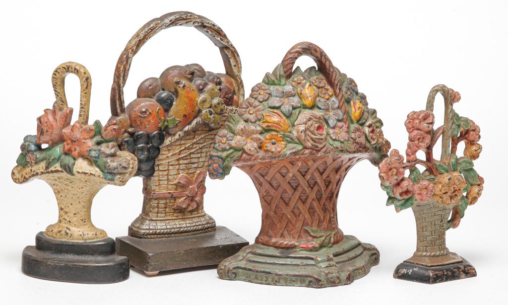 FOUR AMERICAN CAST IRON DOOR STOPS. (1 of 2)