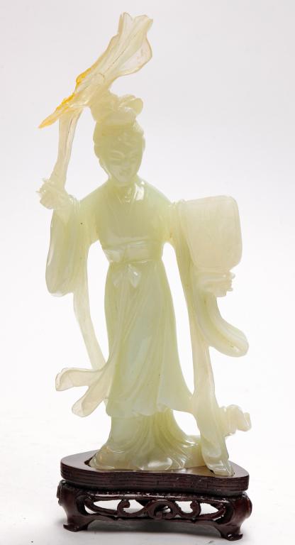 CHINESE SERPENTINE CARVING OF GUAN YIN.: Mid 20th century. Robed figure with fan. Loss and repair. 9.75"h. not including wooden base. With box.