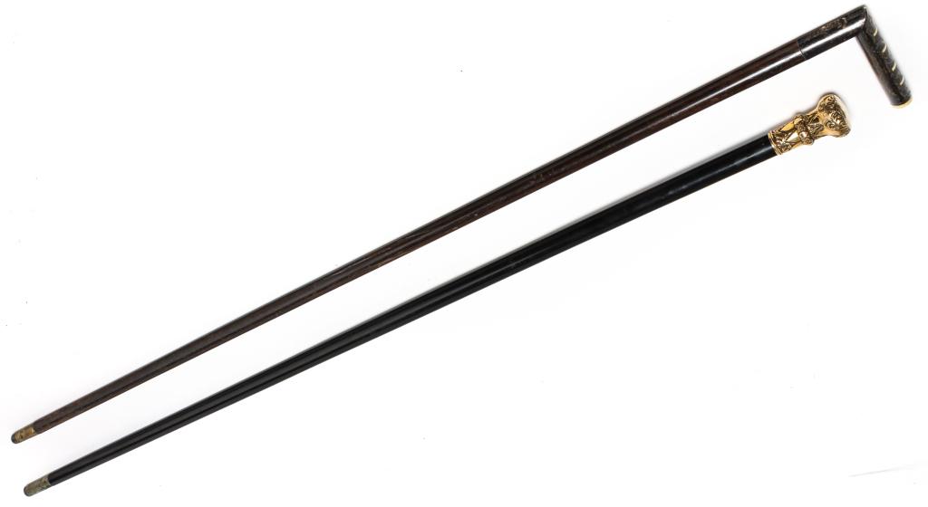 TWO AMERICAN GENTLEMAN'S WALKING STICKS.: Second half 19th century. One has ebonized shaft and gold-filled knob, engraved "Presented by Children to James W. Christy, Oct. 4 [18]78." 35.5"l. And a Malacca shaft with sterling engraved handle wi