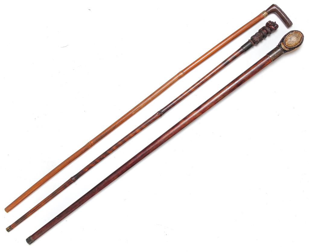THREE CARVED WALKING STICKS. (1 of 5)