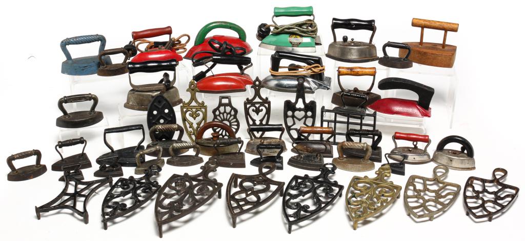 COLLECTION OF AMERICAN SAD IRONS AND TRIVETS. (1 of 5)