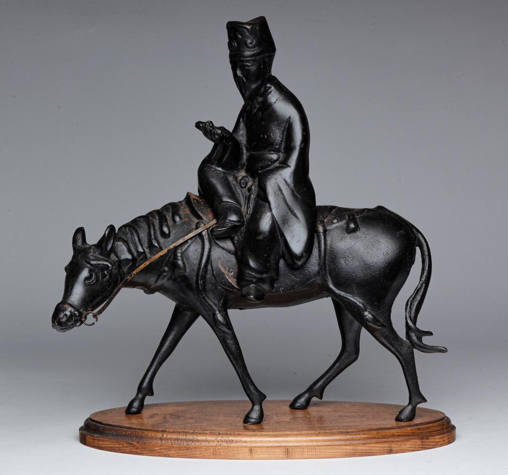 ASIAN CAST IRON HORSE AND RIDER FIGURINE. (1 of 4)