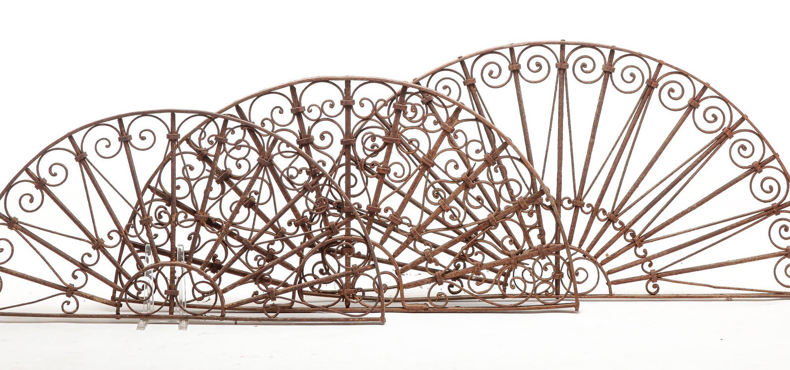 THREE WROUGHT IRON WINDOW GRATES. (1 of 2)