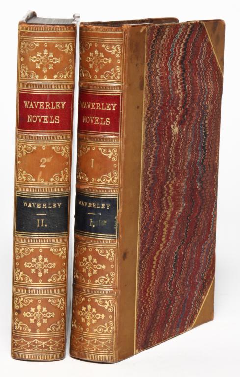 TWO WAVERLEY NOVELS BY SIR WALTER SCOTT.: Two volumes of The Waverley Novels by Sir Walter Scott, Bart. Published by Adam and Charles Black in Edinburgh, 1860 and 1861. Marbleized boards and page ends with gilt wording and decorations on spin