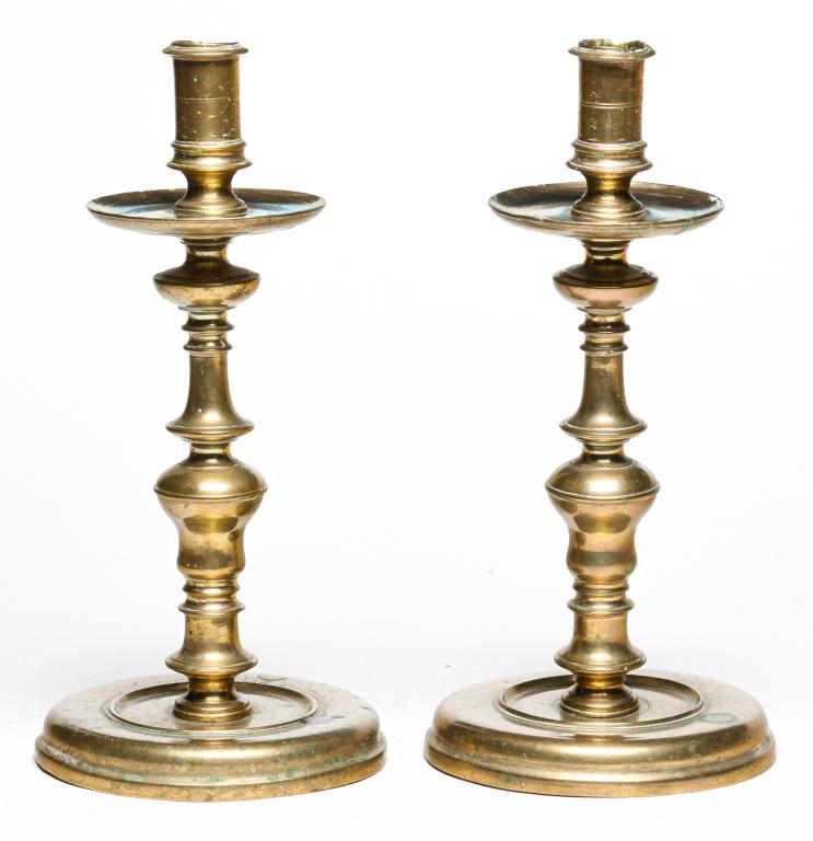 PAIR OF EUROPEAN BRASS CANDLESTICKS. (1 of 4)