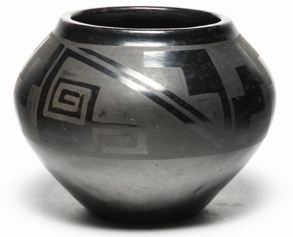 TONITA ROYBAL SAN ILDEFONSO BOWL.: 1892-1945. Signed. Polished black on blackware bowl with geometric designs. Some surface wear. 4.25"h.