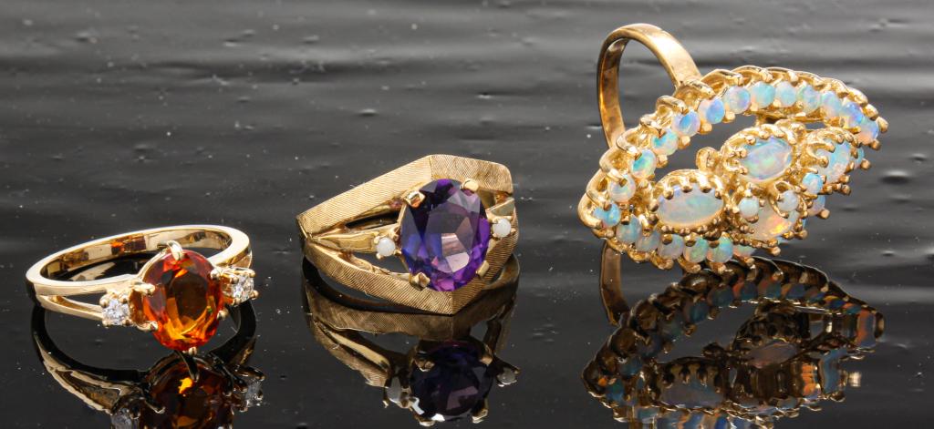 THREE VINTAGE 14K GOLD GEM-SET RINGS. (1 of 7)