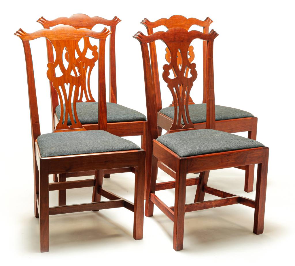 FOUR AMERICAN CHIPPENDALE STYLE CHAIRS.: First half 20th century, mahogany. Shaped crests with finger carved ears, pierced back splats, square legs, rectangular stretchers and slip seats. Refinished. 19" seat, 38.75"h.