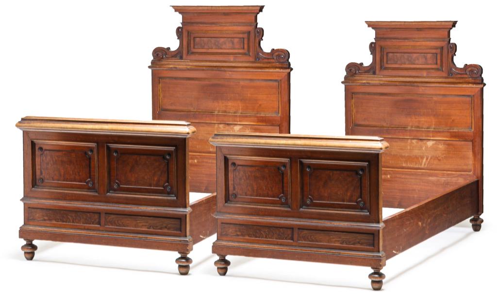 PAIR OF EUROPEAN VICTORIAN TWIN BEDS.: Fourth quarter 19th century, mahogany. Paneled headboards and foot boards with scrolled brackets and rosettes with bun feet, 58.25"h. 42.5"w. 81"W.