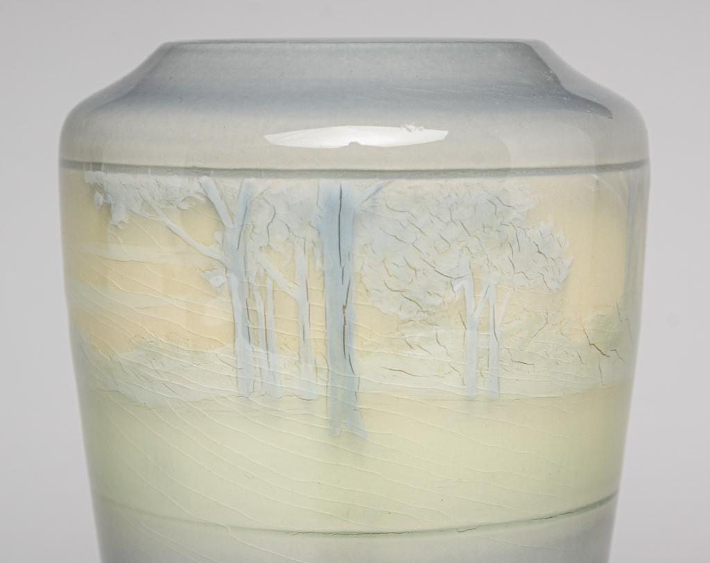 ROOKWOOD IRIS GLAZE VASE BY LENORE ASBURY.: Dated 1909. Shape 1356E with scenic band of trees and hills on blue-grey shaded background, 7"h.