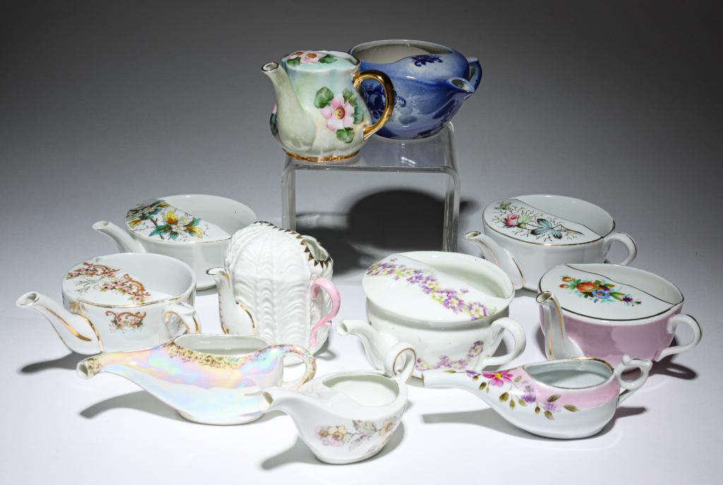 GROUP OF INVALID FEEDERS.: Most are European. Nineteenth and 20th centuries. Floral and iridized decorations on porcelain and earthenware.