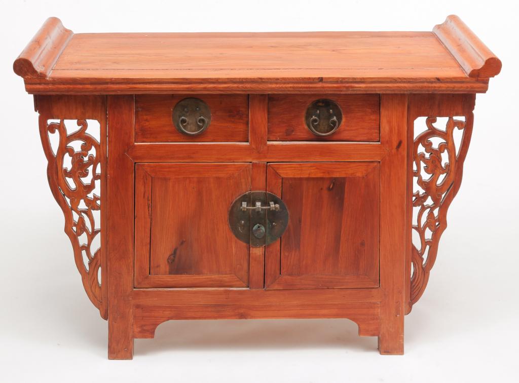 CHINESE CABINET.: Late 19th-early 20th century, elm. Scroll end top, pierce carved dragon bracket supports and two dovetailed drawers over two doors. Age splits and repairs, one end board missing, refinished. 34"h. 48"