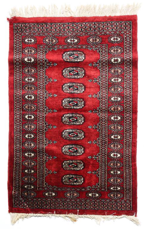 BOKHARA AREA RUG.: Fourth quarter 20th century. Hand-knotted, typical pattern with burgundy field. 31.5" x 44.5".