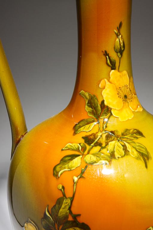 ROOKWOOD STANDARD GLAZE EWER BY M. DALY.: Dated 1887. Shape 808B with yellow vining roses, Professional repair to handle, 19.25"h.