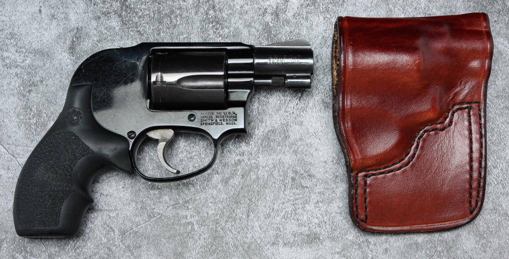 *SMITH & WESSON MODEL 38 AIRWEIGHT REVOLVER.: Smith & Wesson model 38 Airweight .38 special revolver. Blued frame and barrel with textured rubber grips. 2" barrel, 6.5" overall. Includes leather belt holster. Serial number BAE6697. Requires ATF f