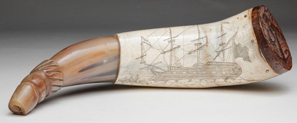 SCRIMSHAW POWDER HORN.: Probably American, 20th century. Carved horn with incised sailing ship and dinghies. Wooden butt cap has carved anchor. 9"l.