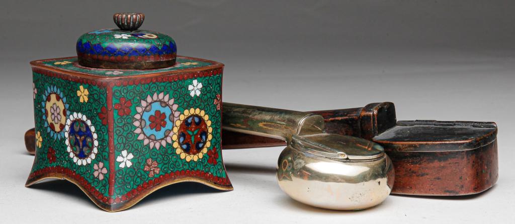 TWO ASIAN PEN HOLDERS AND CLOISONNE INKWELL.: Twentieth century. White metal (nickle?) ink and pen holder (dents), 7"l. and a Japanese bronze ink and pen holder, 8"l. Together with a Chinese cloisonne inkwell with brass insert. 2.75"h.