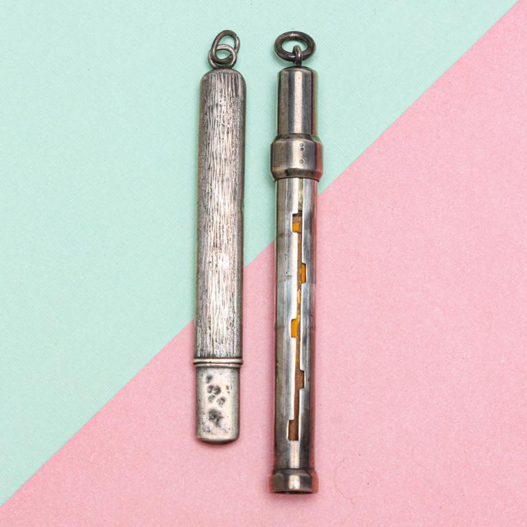 TWO ANTIQUE SILVER PENCIL HOLDERS.: Mid-late 19th century. Large Victorian silver telescopic pencil holder, attached suspension ring. The retailers name of Clark, 20 Old Bond St. & 33 New Bond Street stamped on the barrel, approx. 3.5"l