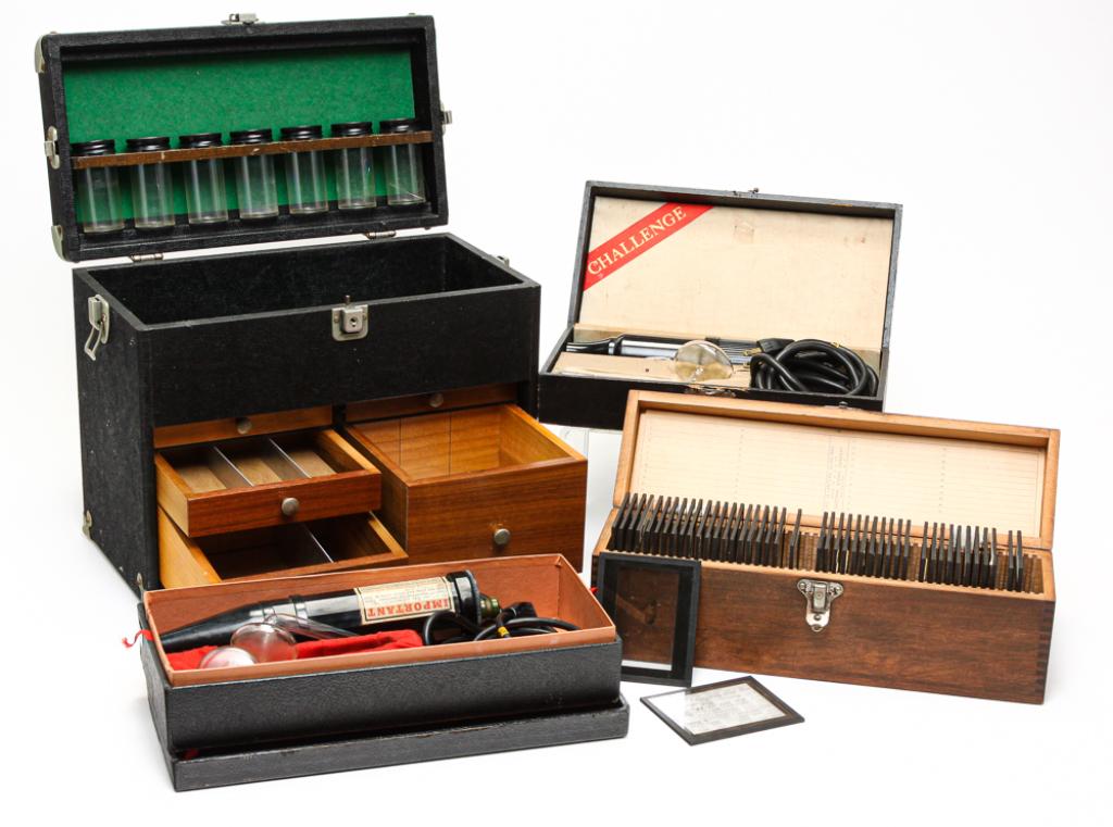 FOUR AMERICAN MEDICAL ITEMS.: Twentieth century. Two quack doctor instruments: "The Challenge" model 310.717 and "Master Violet Ray." And a box of magic lantern anatomy slides and a doctor case with stethoscope.