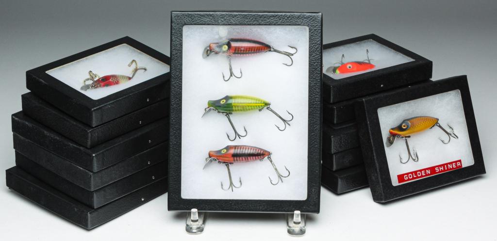 SIXTEEN HEDDON LURES IN DISPLAY CASES.: Group of sixteen Heddon lures. Includes River Runts, Spooks, Go-Deepers, Floaters and Sinkers. All are in protective display cases.